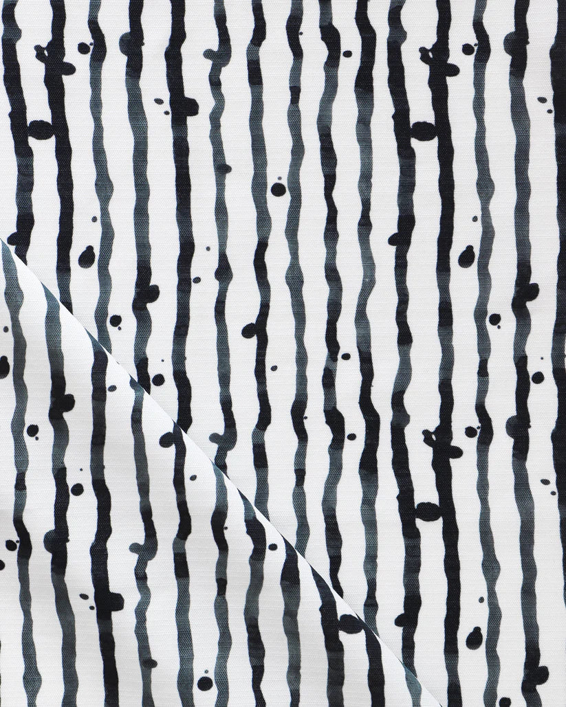 outdoor-fabric-drippy-stripe-slate-greyscale-eskayel-fold-web.webp