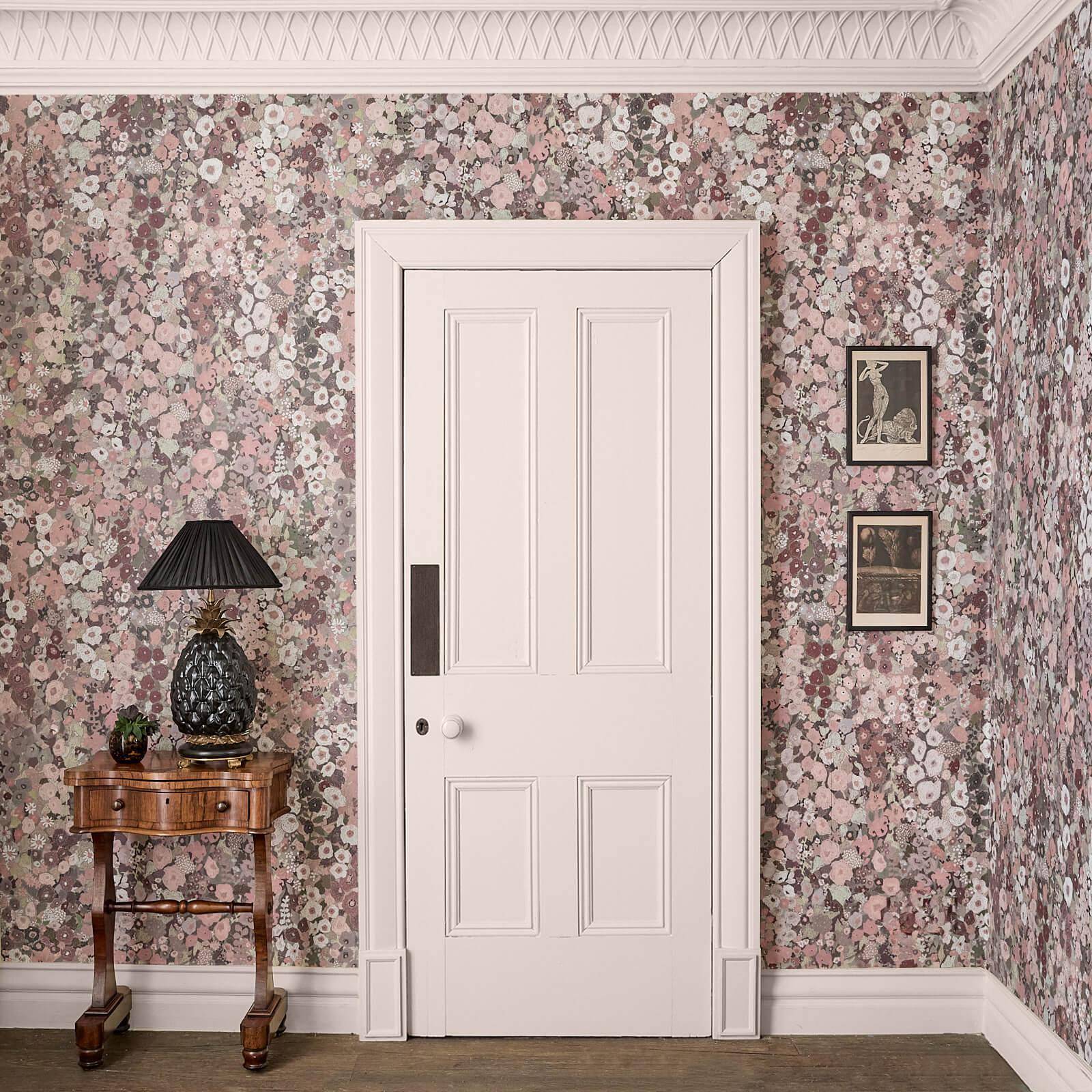 An entry room with floral House of Hackney wallpaper.