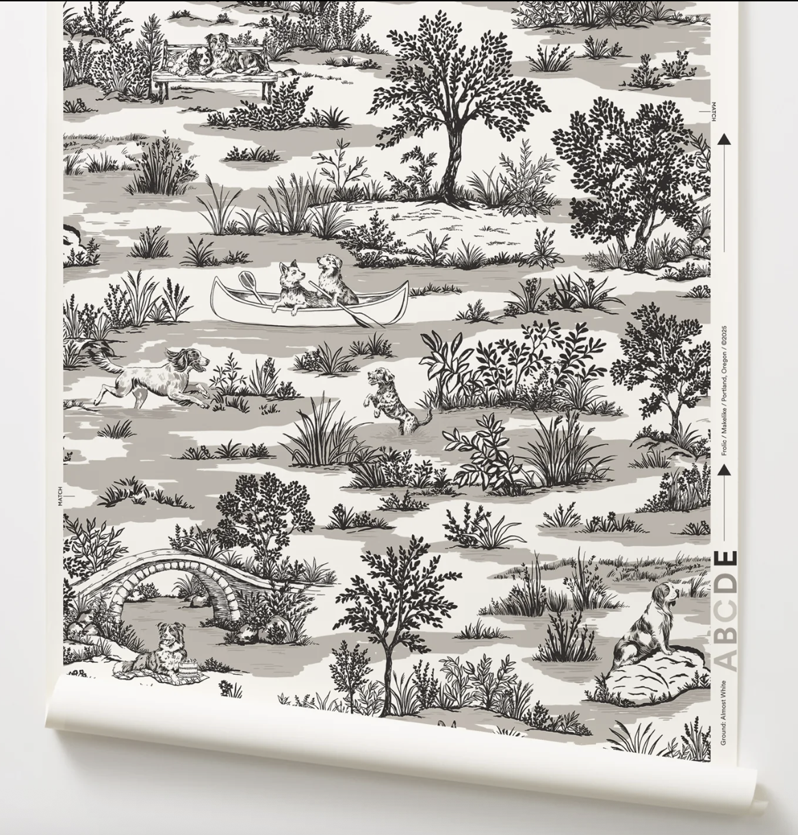 Patterned wallpaper with black and white illustrations of nature and dogs having fun.